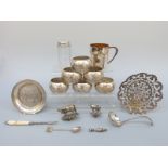 A Victorian hallmarked silver topped dressing table pot, six possibly white metal napkin rings,
