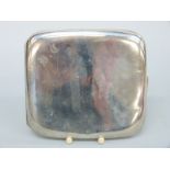 A George V hallmarked silver curved cigarette case, Birmingham 1922,