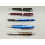 Five various Cross ballpoint pens.