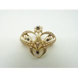 An Art Nouveau 15ct pendant/ brooch set with seed pearls and sapphires, 3.3 x 2.