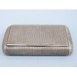 A 19thC French reeded white metal snuff box with French silver marks circa 1819-38, length 8.