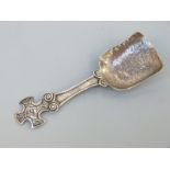 A George VI hallmarked silver caddy spoon with cruciform handle with Celtic knot design,