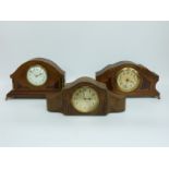 Three circa 1920's wooden cased mantel clocks, two with inlaid decoration,