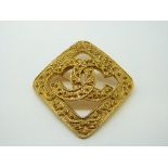 A Chanel gold tone brooch,