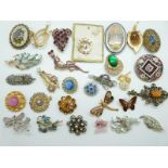 A collection of brooches including Hollywood