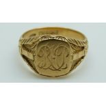 An 18ct gold signet ring with textured foliate decoration to the shoulders, 10.
