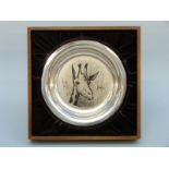 A white metal shallow plate decorated with a giraffe by Bernard Buffet,