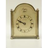 A silvered mantel clock with Mappin and Webb to Roman dial,