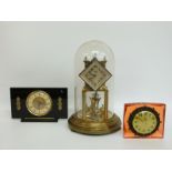 Three mid twentieth century clocks comprising Kundo anniversary example,