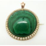 A 9ct gold pendant set with a large malachite cabochon surrounded by graduating seed pearls 3.