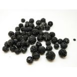 A quantity of carved jet beads