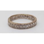 A 9ct gold eternity ring set with diamonds (size N)