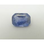 A cornflower blue emerald cut sapphire measuring approximately 6.