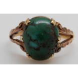 A 9ct gold Edwardian ring set with a large turquoise cabochon, B'ham 1903, 3.