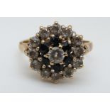 A 9ct gold ring set with sapphires and cubic zirconia (size L)