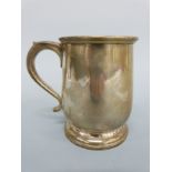 A George V hallmarked silver baluster shaped tankard, Birmingham 1939 maker Adie Brothers, height 9.