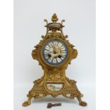 A late 19thC balloon style ormolu mantel clock with Sevres style panels and dial decoration,
