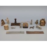 A small hand decorated icon pendant and miniature metal animals including a dachshund