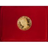 A cased, Pobjoy Mint, Queen Mother 9ct gold one crown coin with certificate,