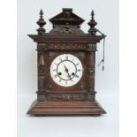 Junghans late 19thC mahogany cased mantel clock with carved decoration,