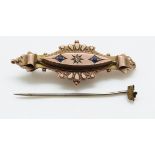 A 9ct gold Victorian brooch set with a diamond and two blue stones, 2.2g, 4.