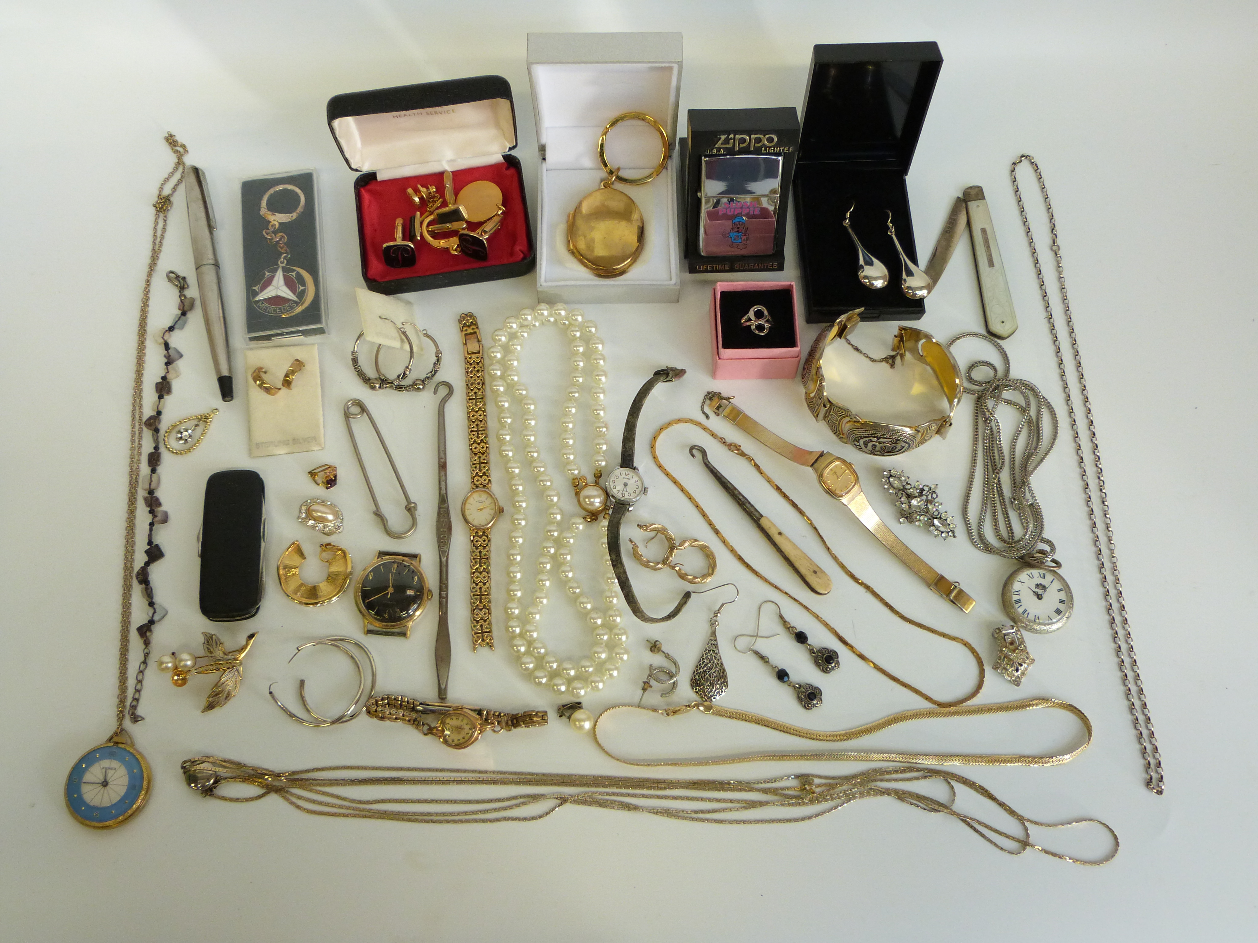 A collection of costume jewellery, watches, silver penknife, Zippo lighter,