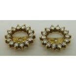 A pair of 14ct gold earring surrounds set with diamonds