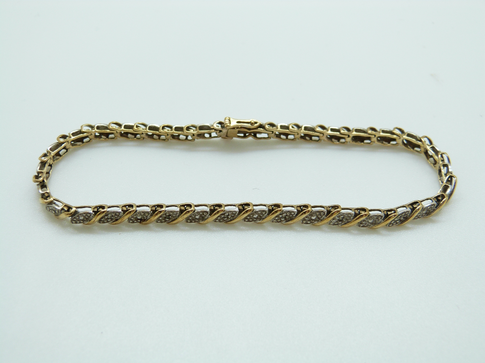 A 9ct gold bracelet set with diamonds, 7. - Image 2 of 4