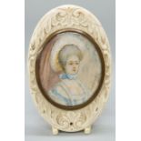A 19thC portrait miniature on ivory, head and shoulders bust of a lady in fine attire,