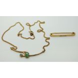 A silver gilt necklace set with oval emeralds and a 9ct gold brooch