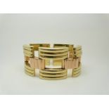A Tiffany & Co bi-coloured 14k gold bracelet made up of rectangular ridged links, 85.3g, width 3.