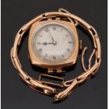 9ct gold wristwatch with Roman numerals, blued hands and silvered face,