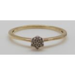 A 9ct gold ring set with diamonds in a cluster, 1.