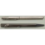 Two Caran d'Ache ballpoint pens comprising 849 with metallic grey barrel (12cm) and a silver plated