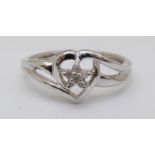 A 9ct white gold ring set with diamonds in a heart shaped setting, 1.