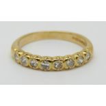 An 18ct gold half eternity ring set with diamonds, 3.