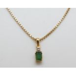 An 14ct gold pendant set with an emerald and a diamond on 14ct gold chain, 5.