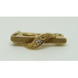 A 14ct gold pearl clip set with a diamond in original Garrard box