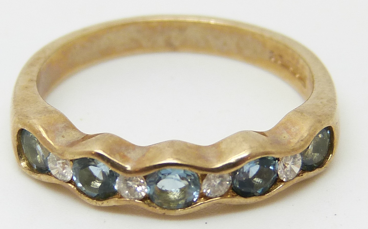 A 9ct gold ring set with topaz and diamonds