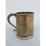 A hallmarked silver tankard, marks rubbed, height 9cm,