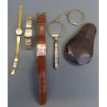 Three various wristwatches comprising Elgin tonneau shaped gold filled wristwatch,