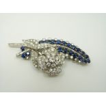 A platinum brooch set with 19 round cut sapphires,