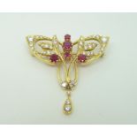 An 18ct gold brooch set with diamonds and synthetic rubies in the Art Nouveau style by T.O.D, 3.