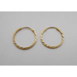 A pair of 18ct gold hoop earrings, 2.