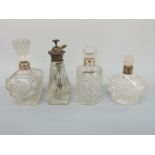 Two hallmarked silver mounted dressing table bottles and two other dressing table bottles,