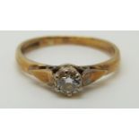 A 9ct gold ring set with a round cut diamond of approximately 0.