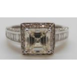 An 18ct white gold ring set with a square cut diamond of approximately 1.