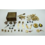 A collection of costume jewellery to include gold plated earrings in the form of leaves, earrings,