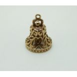 A 9ct gold charm in the form of a bell,