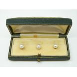 Three 9ct gold studs each set with a pearl in original box
